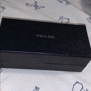 Never worn Prada sun glasses, will lower price